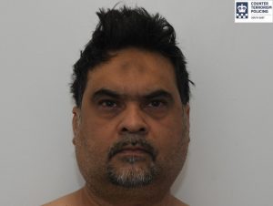 Custody photo of Asad Bhatti